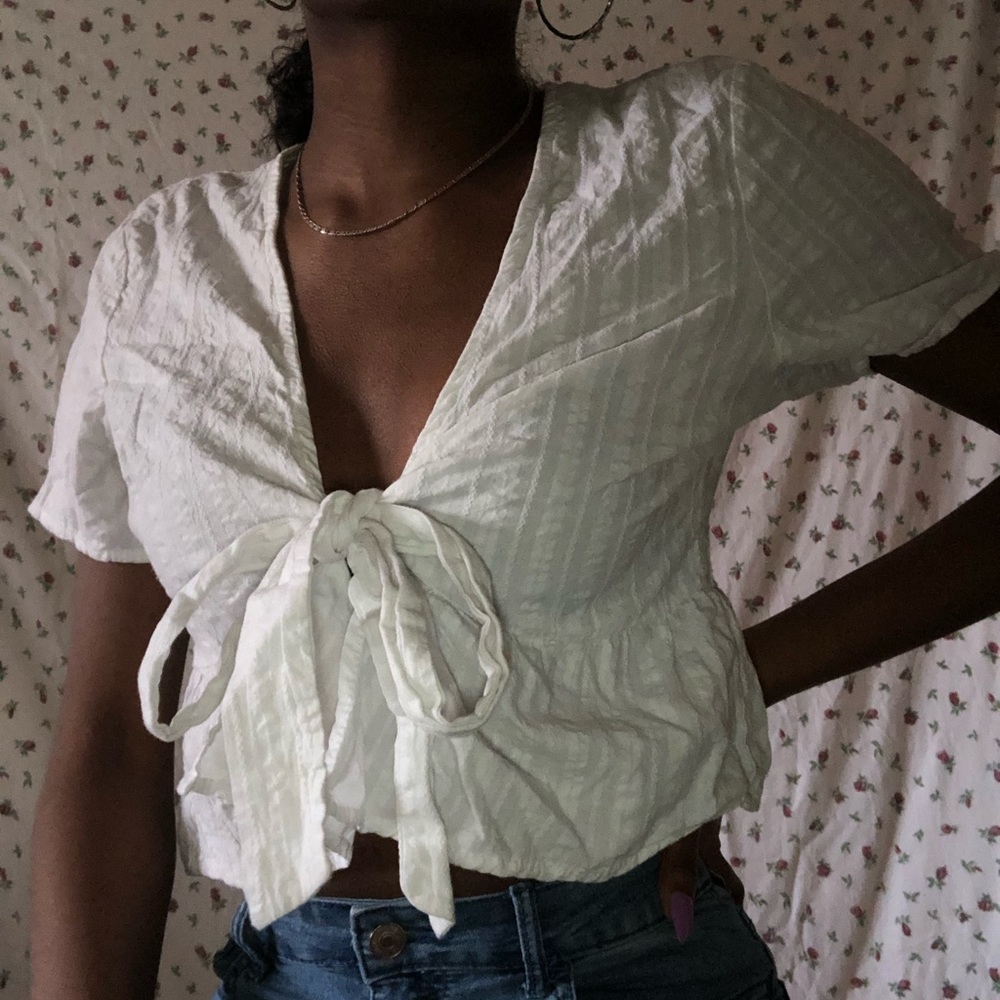 PEPLUM TIE TOP